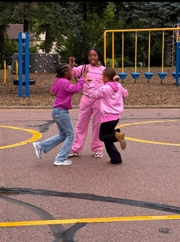 3 girls giving high 5's