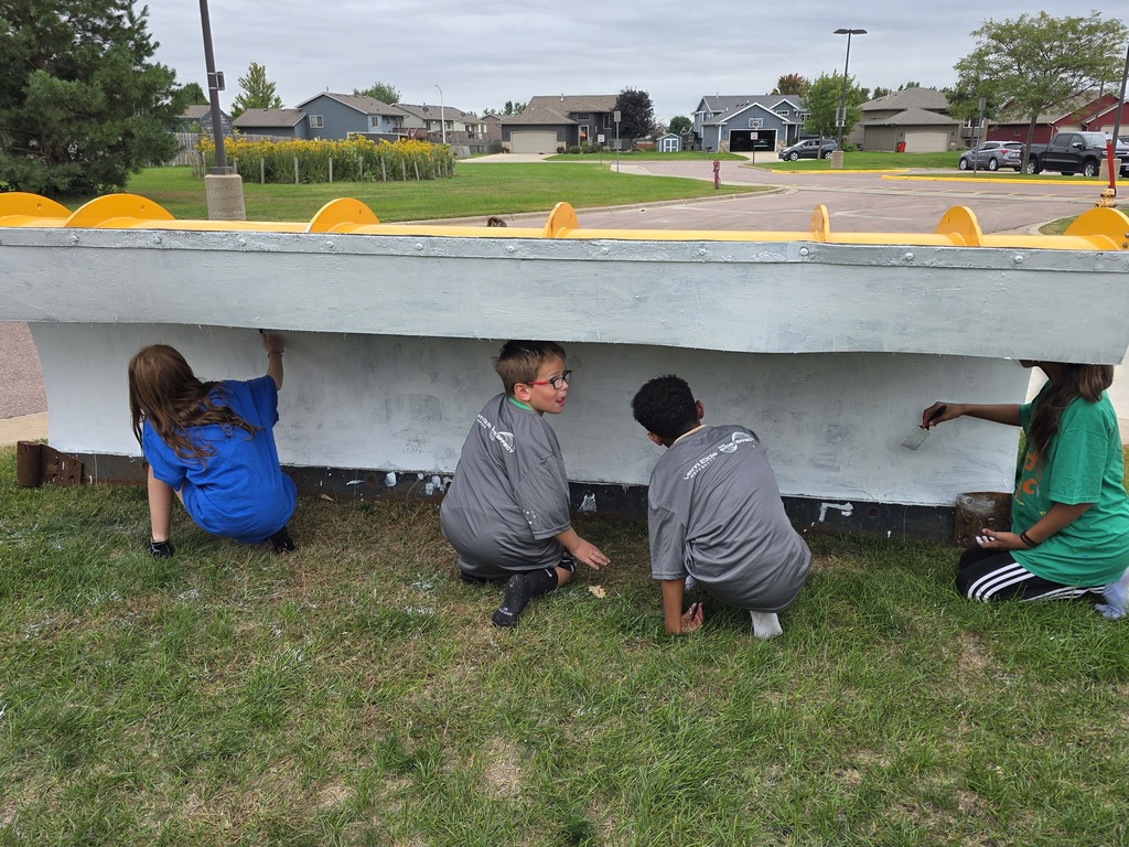 Students painting the plow 