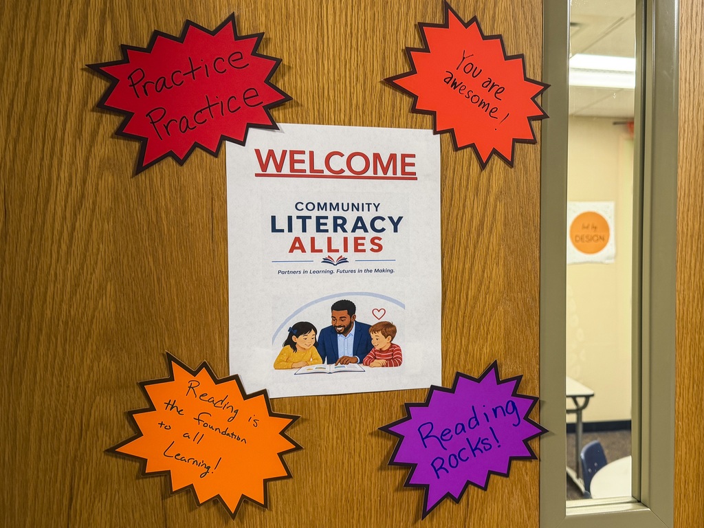 Anne Sullivan Elementary displays a "welcome Literacy Allies" door that has motivational messages like "reading rocks," "you are awesome" and "reading is the foundation for lifelong learning" to help inspire incoming Literacy Ally volunteers