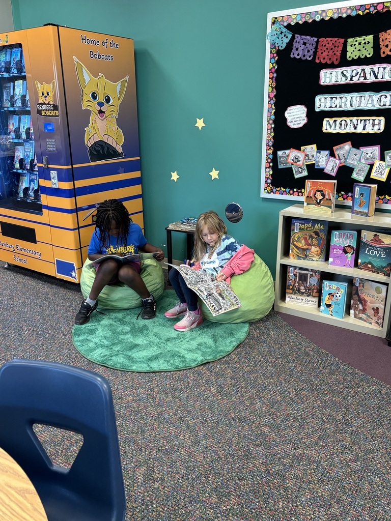 2 girls reading on beanbags