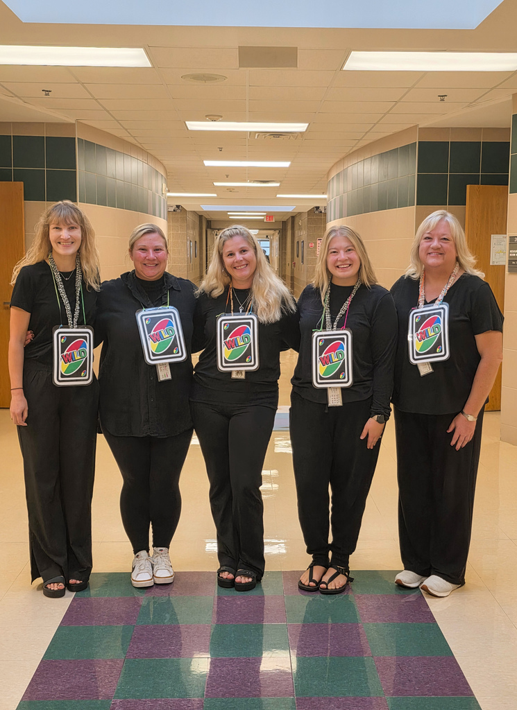 Teachers dressed as uno wildcards