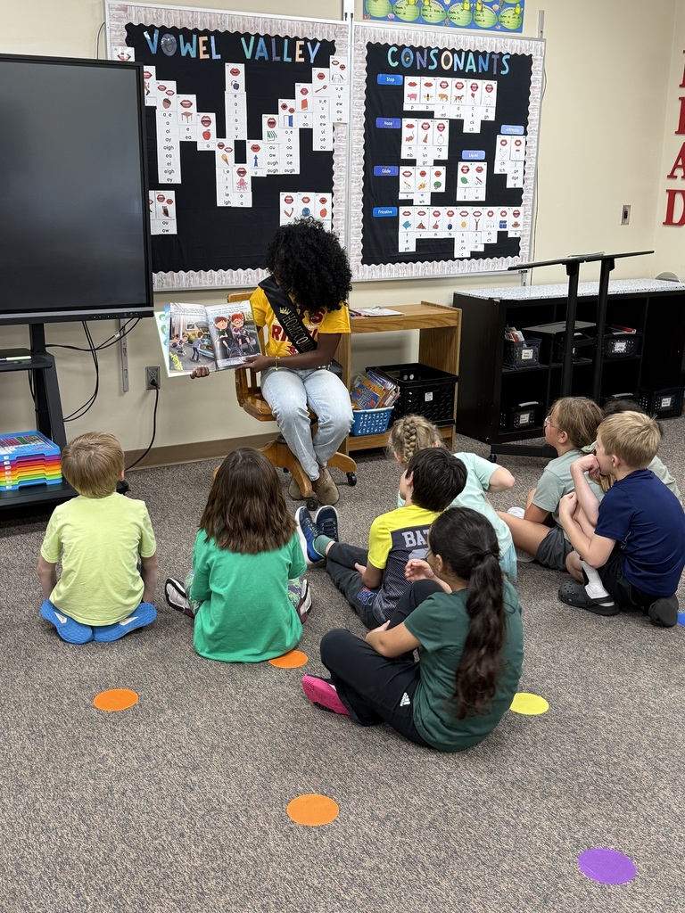 RHS student reading a story to classroom 