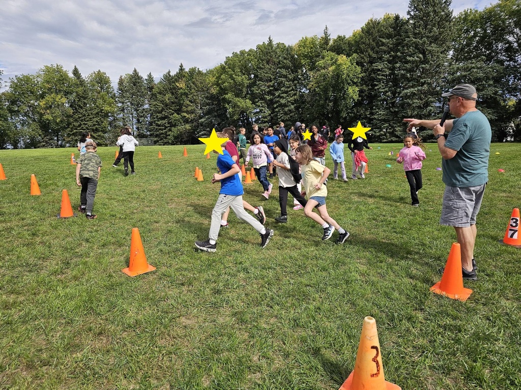 4th grade students walking around in a circle