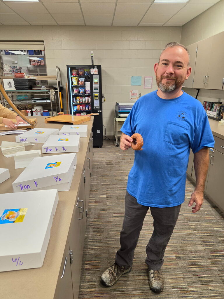 Custodian with doughnut. 