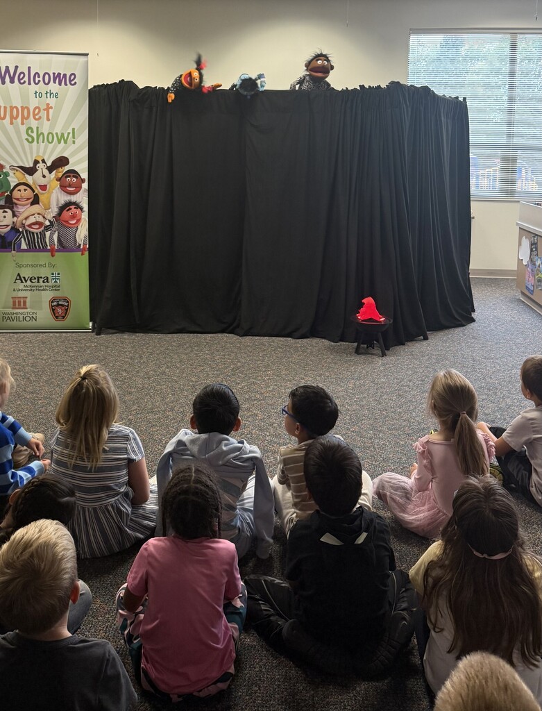 students watching a puppet show