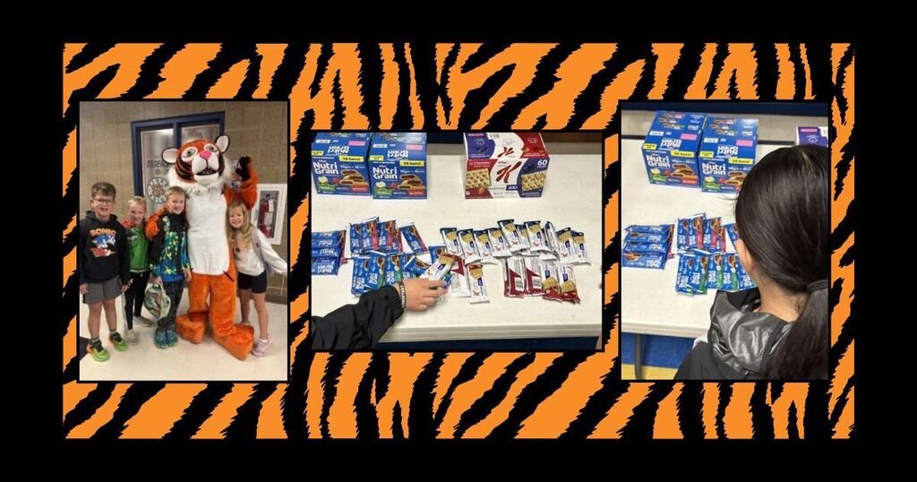 Students posing with Harvey Dunn Mascot, Harvey. Table of snacks.