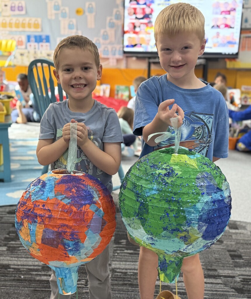 Students holding their hot air balloon project.