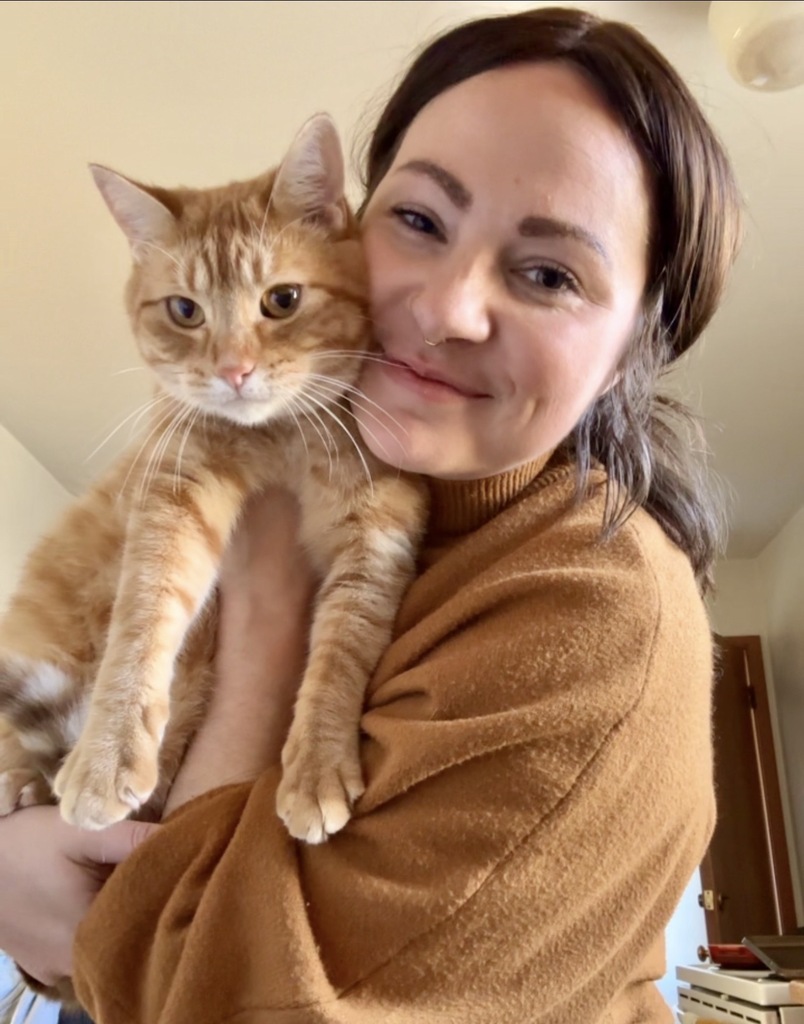 Miss Osterberg and her cat, Greg.