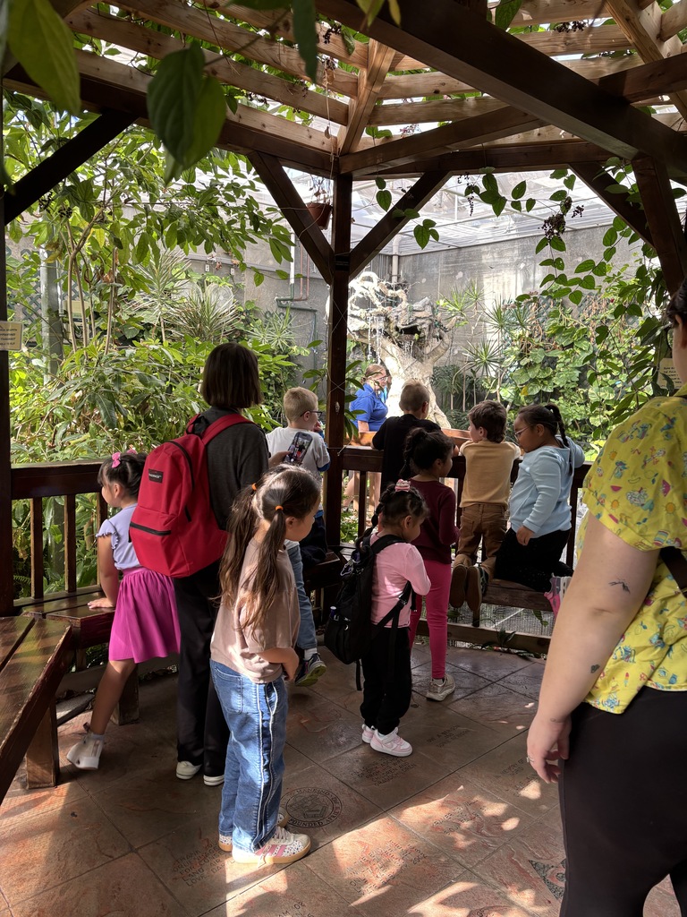 students and teacher at the butterfly house