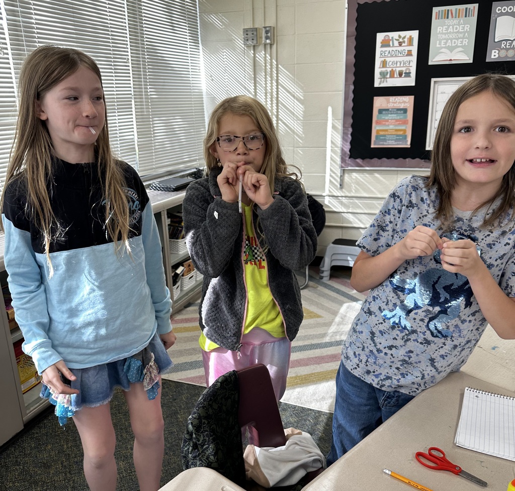 students with straw instruments