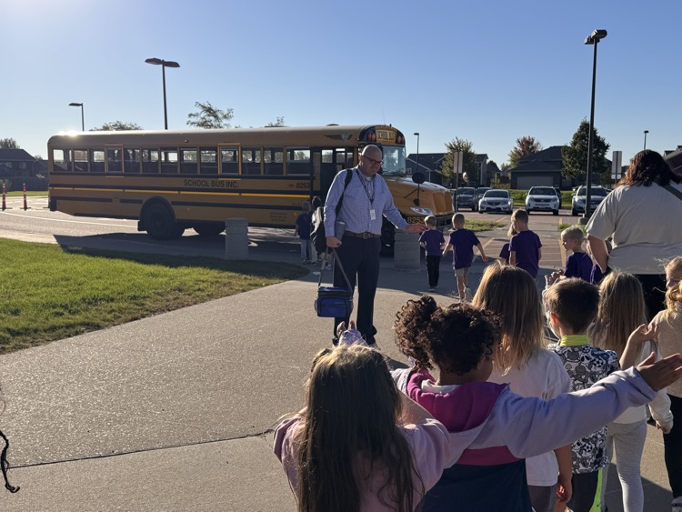 students line up to get on bus 
