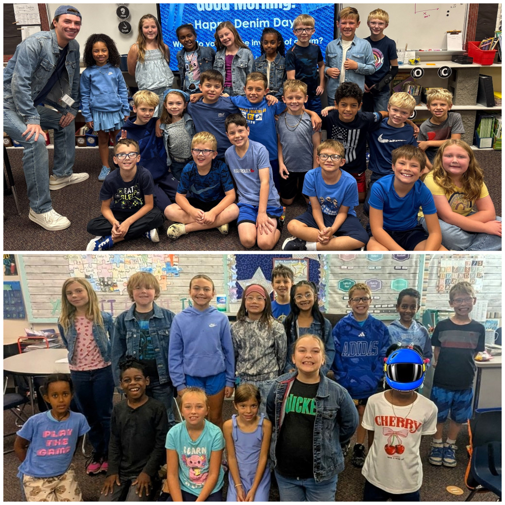 Classroom of students dressed in denim or blue smiling for a group picture.