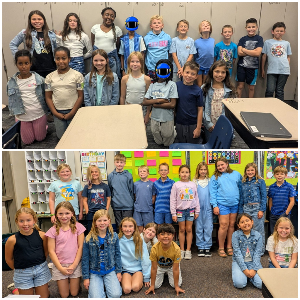 Classroom of students dressed in denim or blue smiling for a group picture.