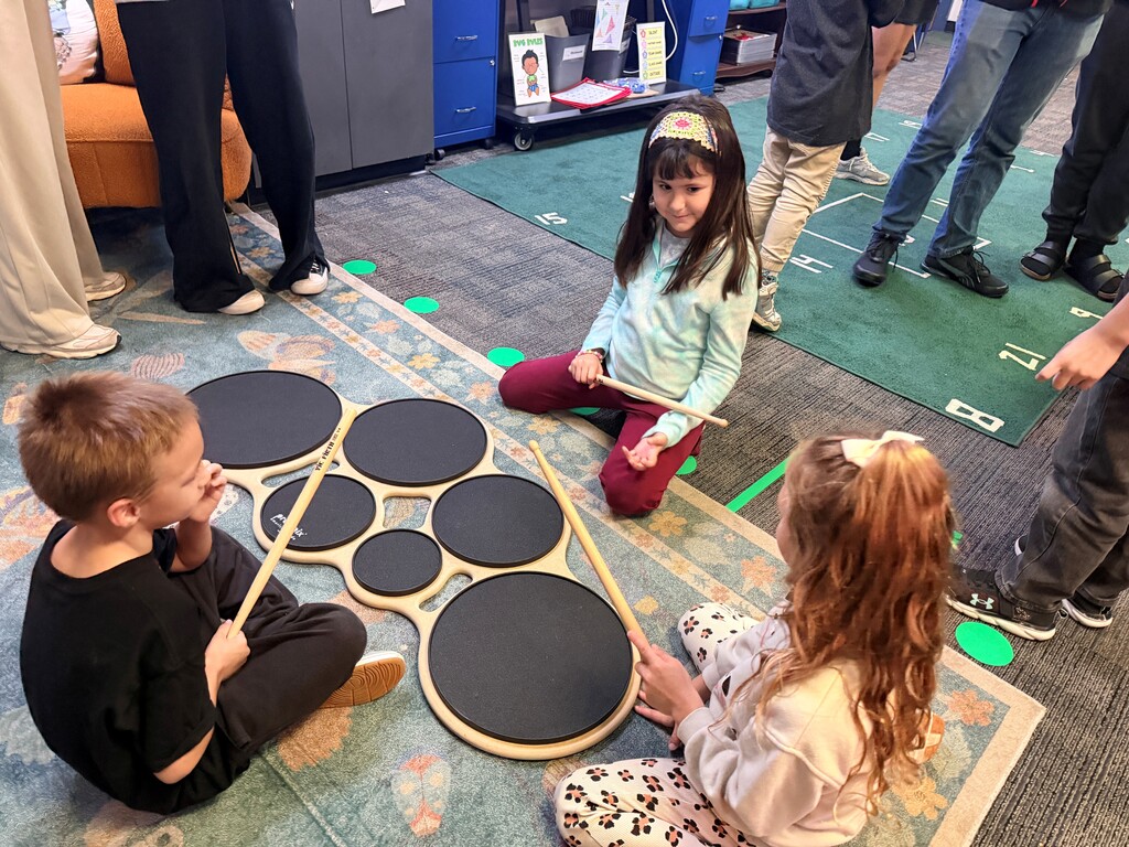 students with a drum pad
