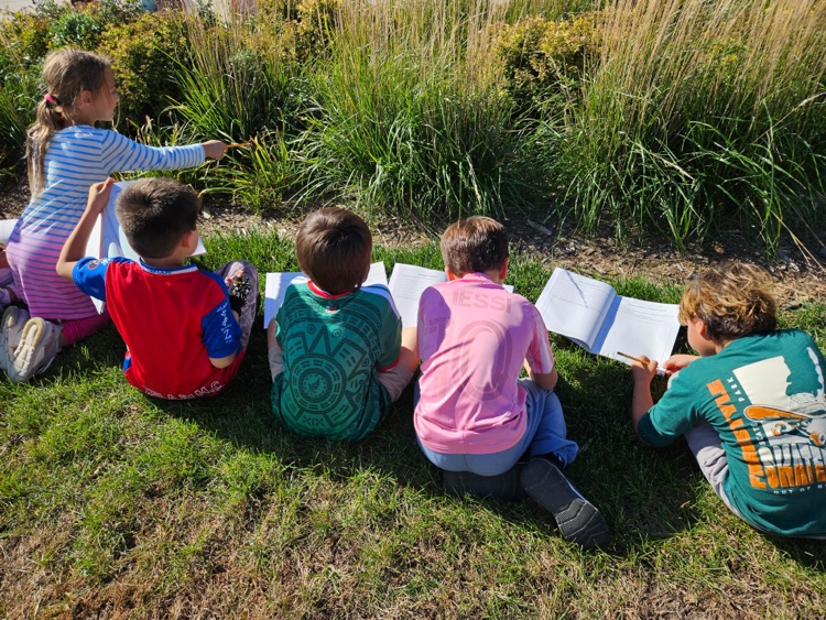 students writing in their science journal