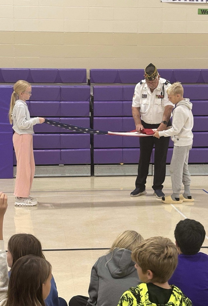 children learning to fold United States flag