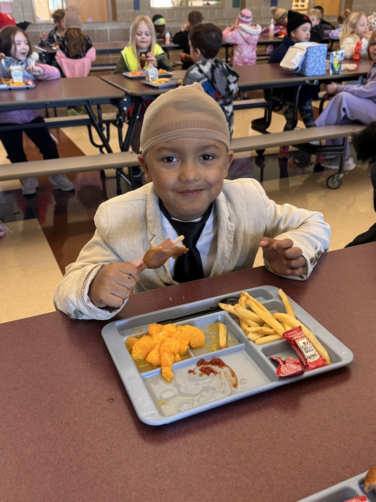 student dress up in a suit for principal day