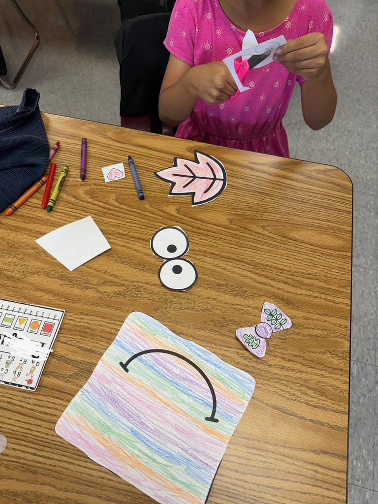 Student coloring a square pumpkin
