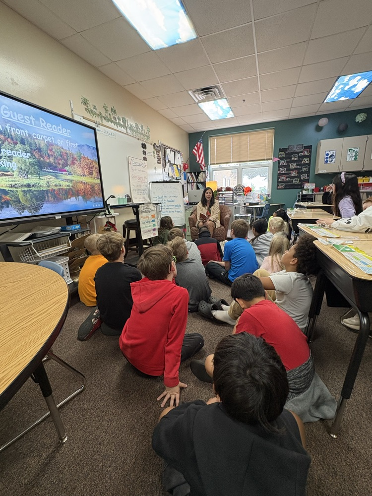 book donor reading to 403 students