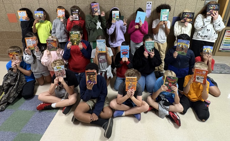 403 students showing off their books