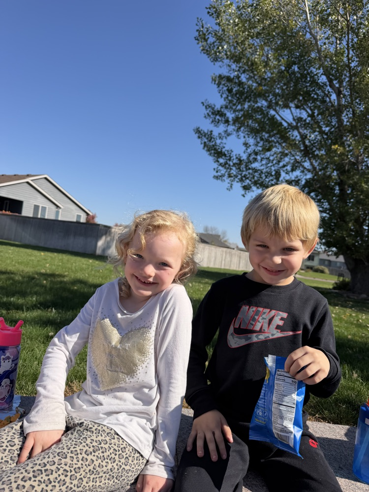 students enjoying snack time at the outdoor classroom 