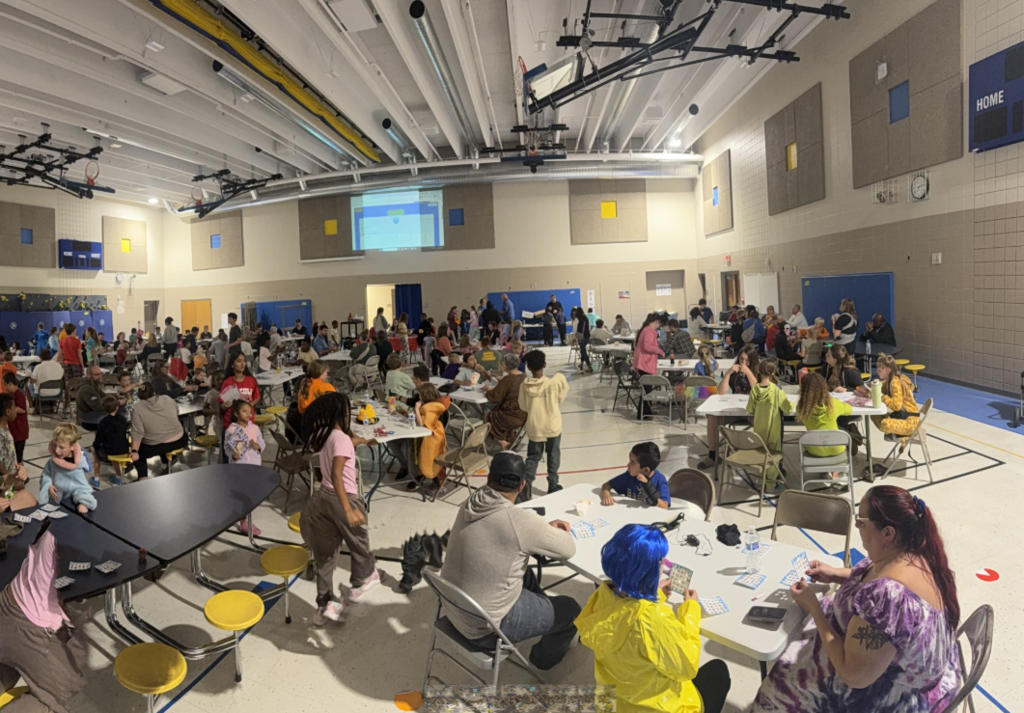 Susan B Anthony's gym packed with families for Bingo Night.