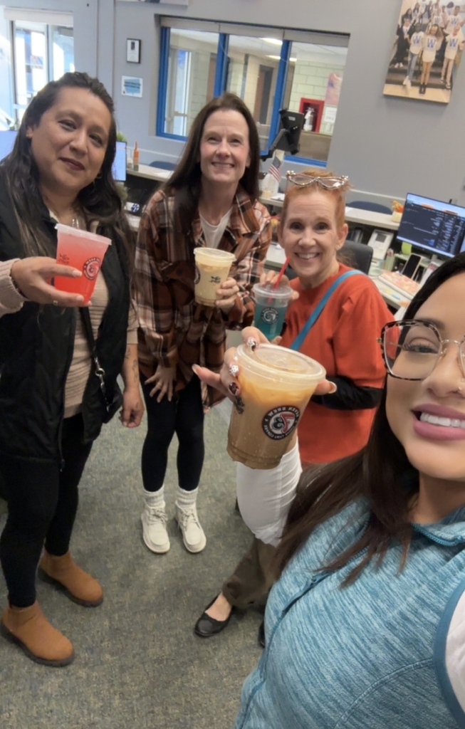 Group of people holding coffee