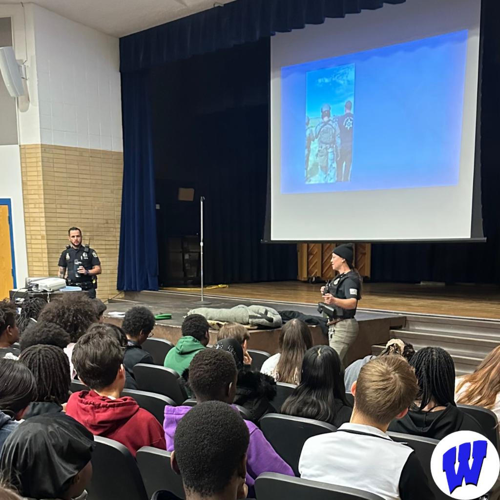 Officer Neal, K-9 Officer Fox, and dog, Rex, visited Whittier for a presentation to 8th grade students.