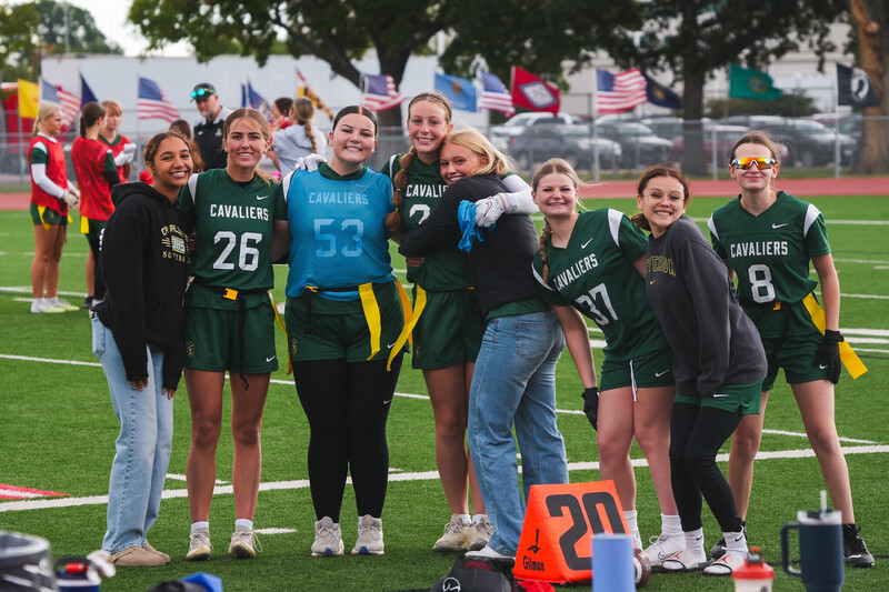 Jefferson High School Girls Flag Football members happily pose together at the very first Girls Flag Football Jamboree event at Howard Wood Field