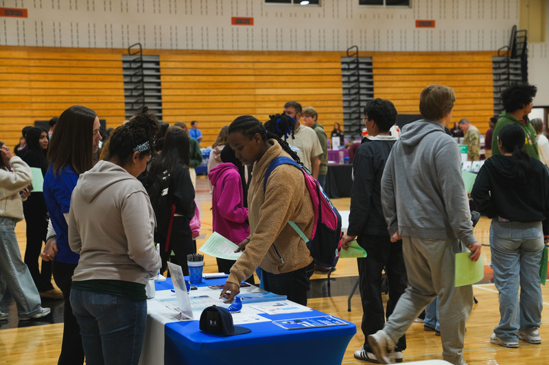 A student participates in a college and career fair at Washington high school 