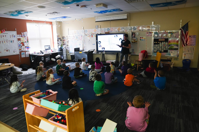 A science educator gives a presentation to a group of kindergarten students