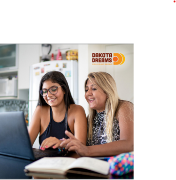 Two people on computer. 