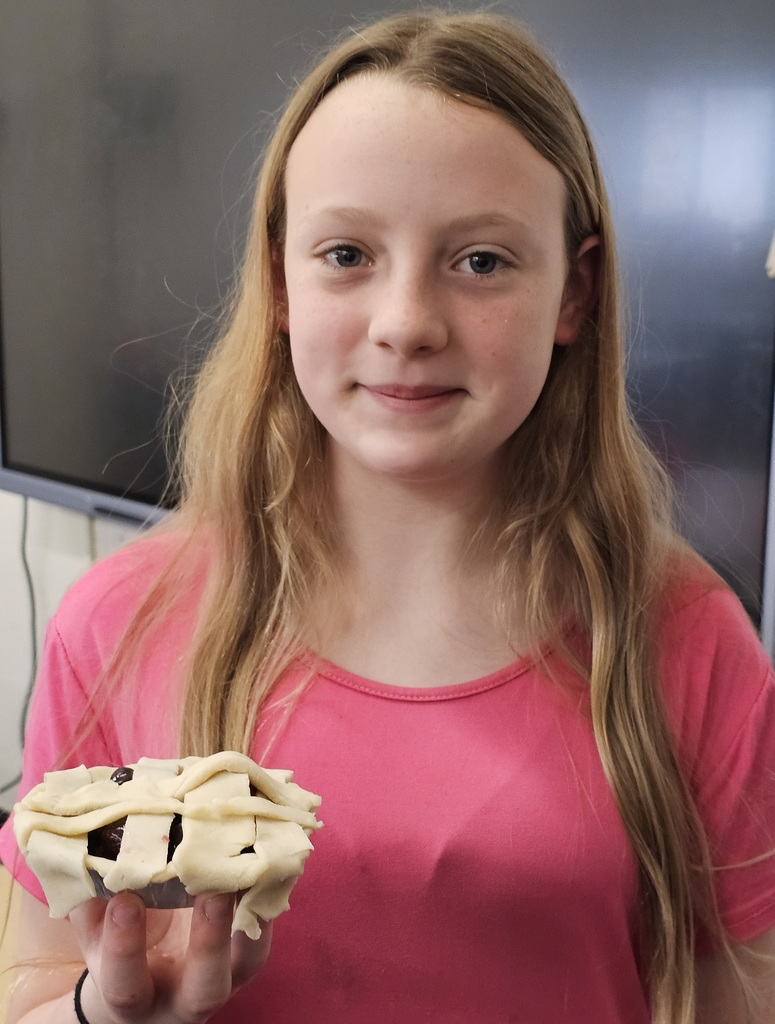 SIVELLS BEND ISD -
3rd, 4th, and 5th graders learned how to crimp pie crust dough around the edges and make a lattice topped pie & peel apples.  They learned about cherries and the cherry pitting tool.  They learned how cornstarch thickens the juices and a pinch of salt makes a pie better.  They learned that apple pies should be mounded before baking and berry pies should not!  We  had a crazy, noisy, wonderful day creating… and we aren’t done yet!  Stay tuned!