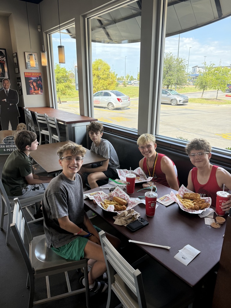 athletes eating at Canes