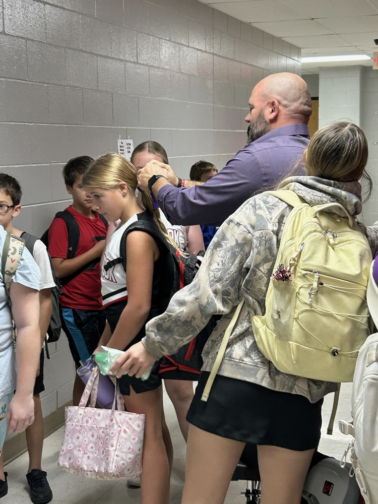 Scheihing helping a student 