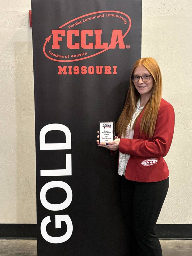 Raegan Lewis pictured with FCCLA award