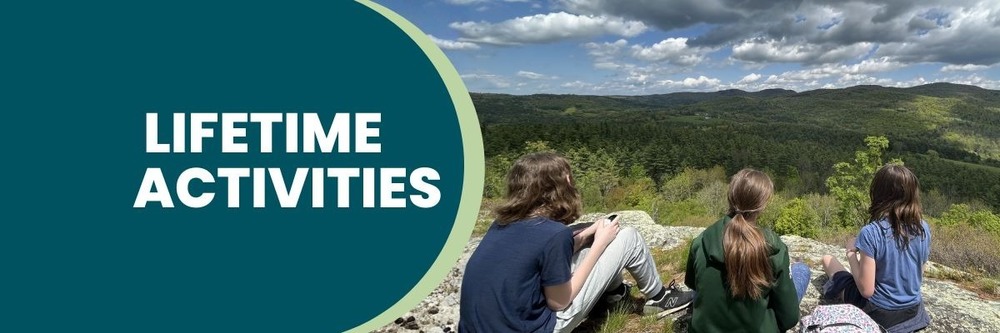 Banner graphic with the words “Lifetime Activities” on a teal circle overlay, next to a photo of three students sitting on a rocky overlook, looking out over a wide green forested landscape and hills under a partly cloudy sky.