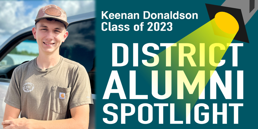 District Alumni Spotlight promotional graphic featuring Keenan Donaldson, Class of 2023. On the left side, a photo shows Keenan wearing a hat and a Long Trail Electrical Contractors t-shirt smiling in front of a vehicle. The right side features a teal background with bold text that reads "Keenan Donaldson Class of 2023 - District Alumni Spotlight" illuminated by an illustrated yellow spotlight beam.