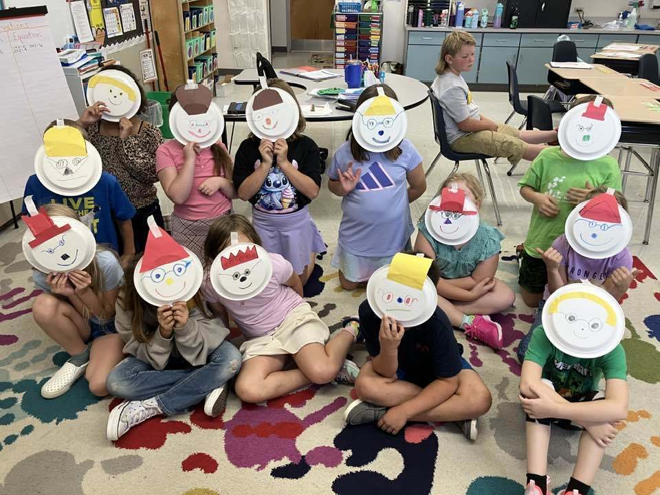 Third graders displaying glyphs that show their feelings about math and their preferred learning styles."