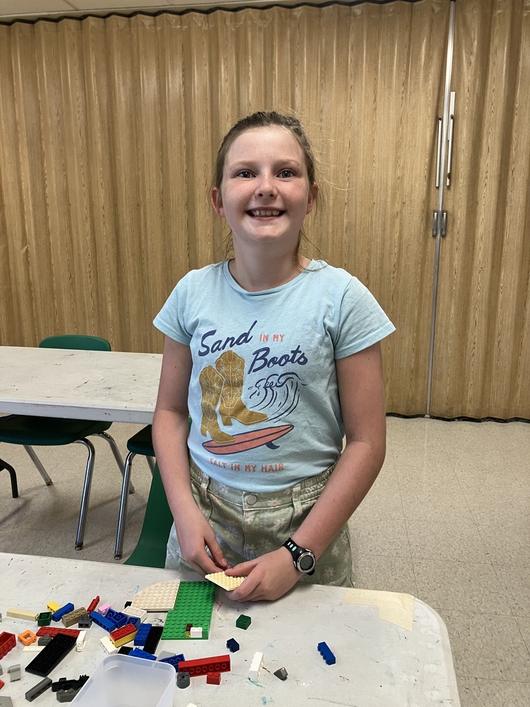 Students in STEAM class using Legos to build