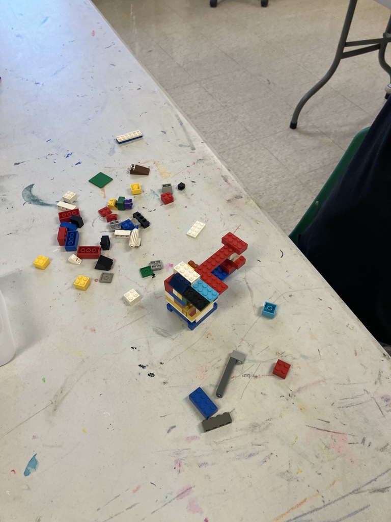 Students in STEAM class using Legos to build