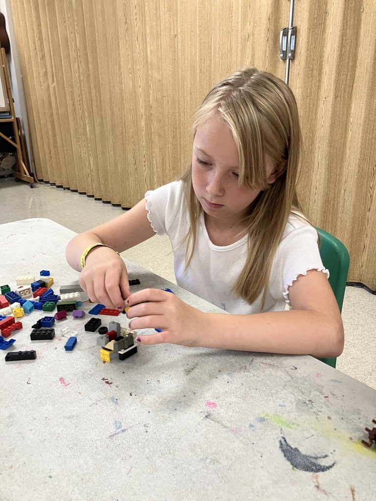 Students in STEAM class using Legos to build