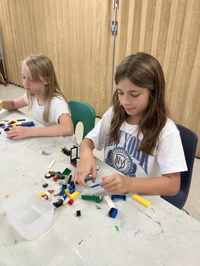 Students in STEAM class using Legos to build