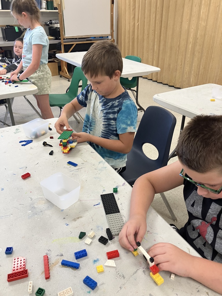 Students in STEAM class using Legos to build