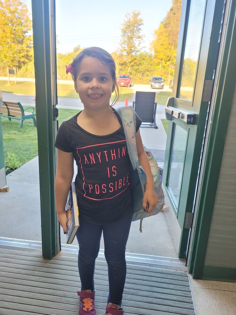 Student wearing anything is possible shirt