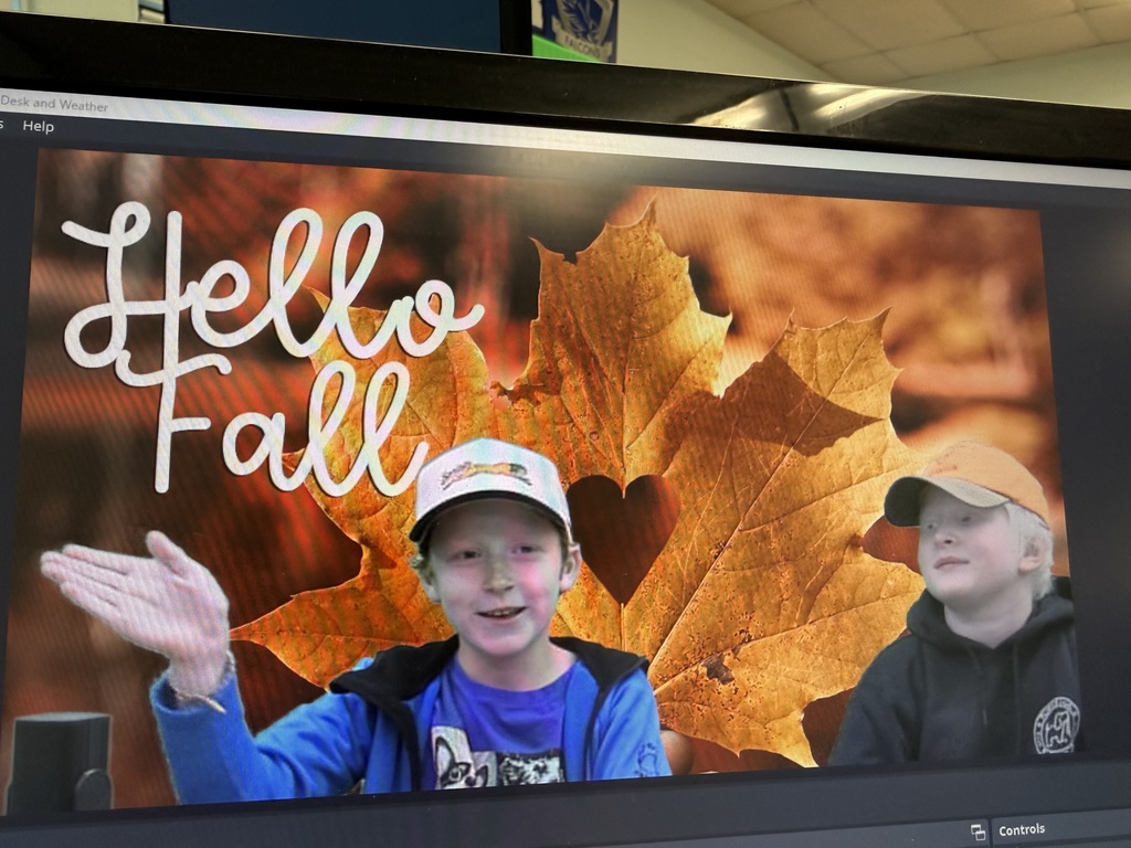 A boy with a baseball cap is shown on a video screen. The screen has an autumn-themed background with a heart cut out of a leaf and the words "Hello Fall."