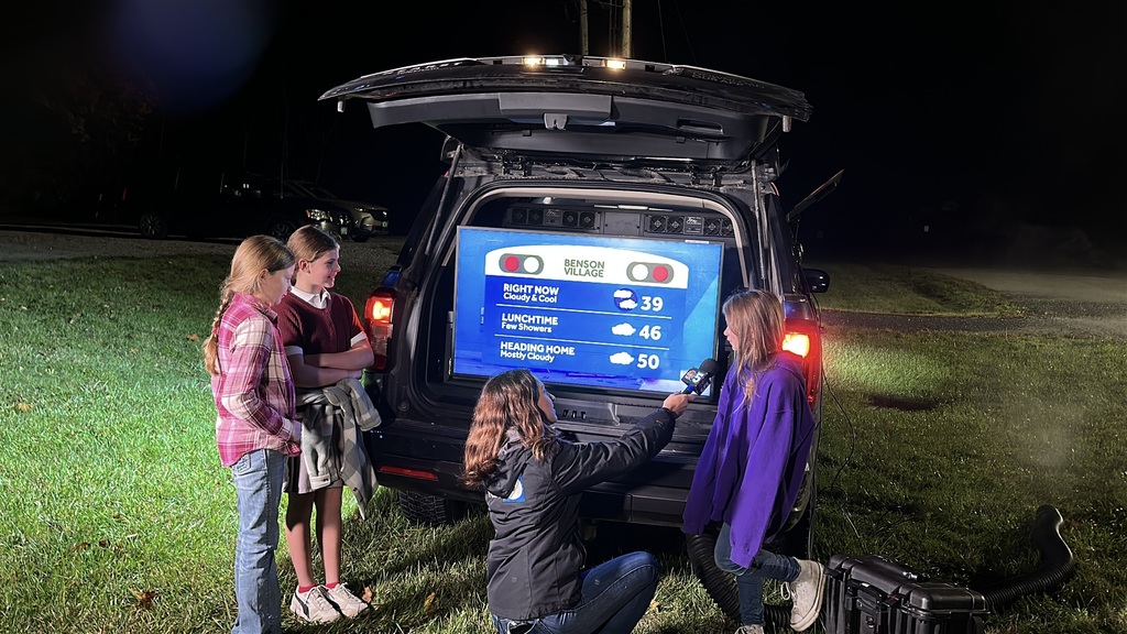 Students helping with the Live Weather forcast at Benson Village School