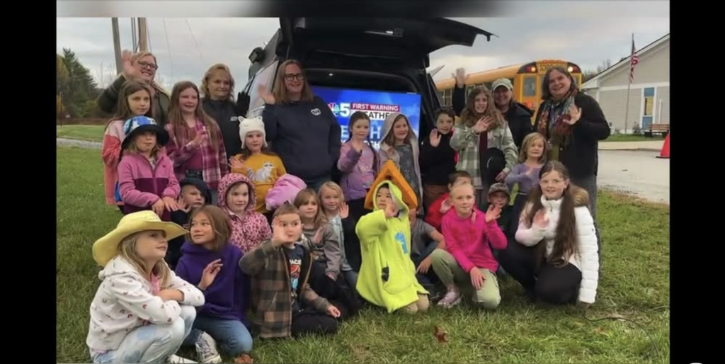 Screen shot of  Benson Village School students and teachers in front of the NBC5 Weather station during their live broadcast of Weather at Your School