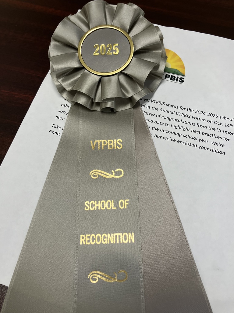 the image shows a congratulatory letter from Vermont PBIS to the Benson School Team for achieving silver-level status for the 2024-2025 school year, along with the silver-colored award ribbon for the achievement.