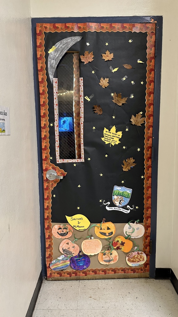 Door with a black background decorated with fall leaves, pumpkins, and a moon; labeled “Salinas & McMahon Advisories.”